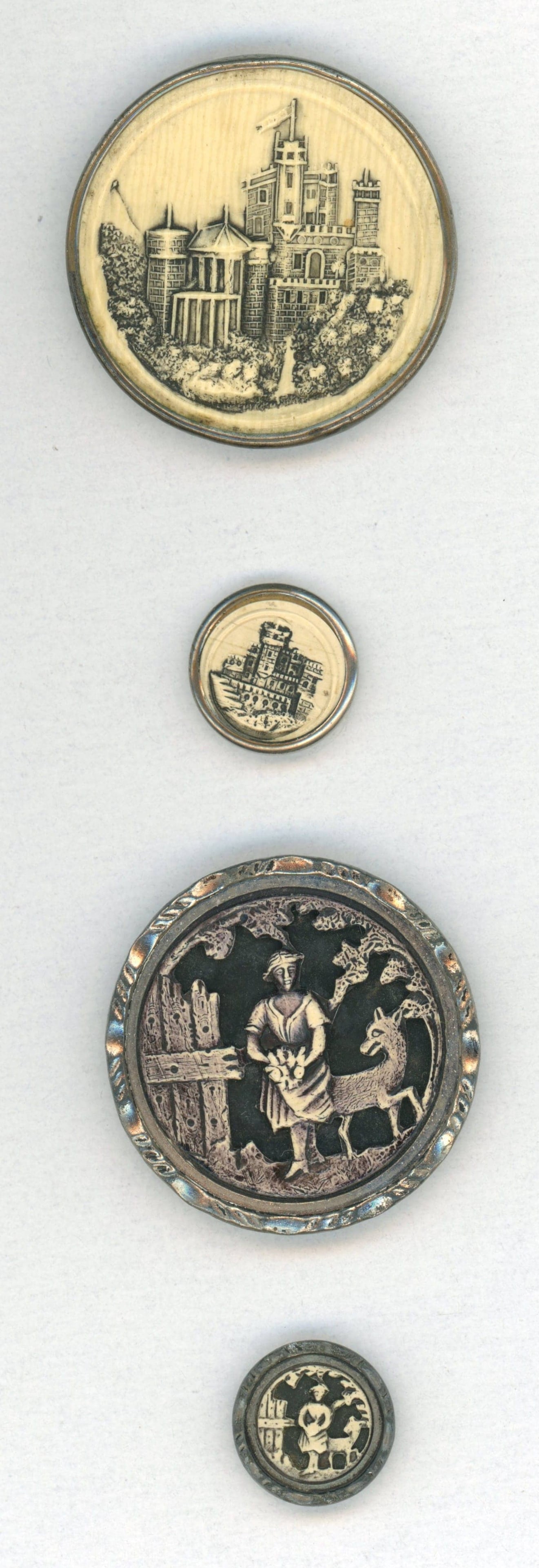 A SMALL CARD OF DIVISION ONE PICTORIAL BUTTONS: 4 Small/Large 19th century "Mother-Daughter" examples. DimensionsSM=Less than 3/4", Medium=3/4" to 1 1/4". Large=1 1/4" and above, extra large=1 3/4" and above Date or EraDIVISION 1=PRE 1918 AND