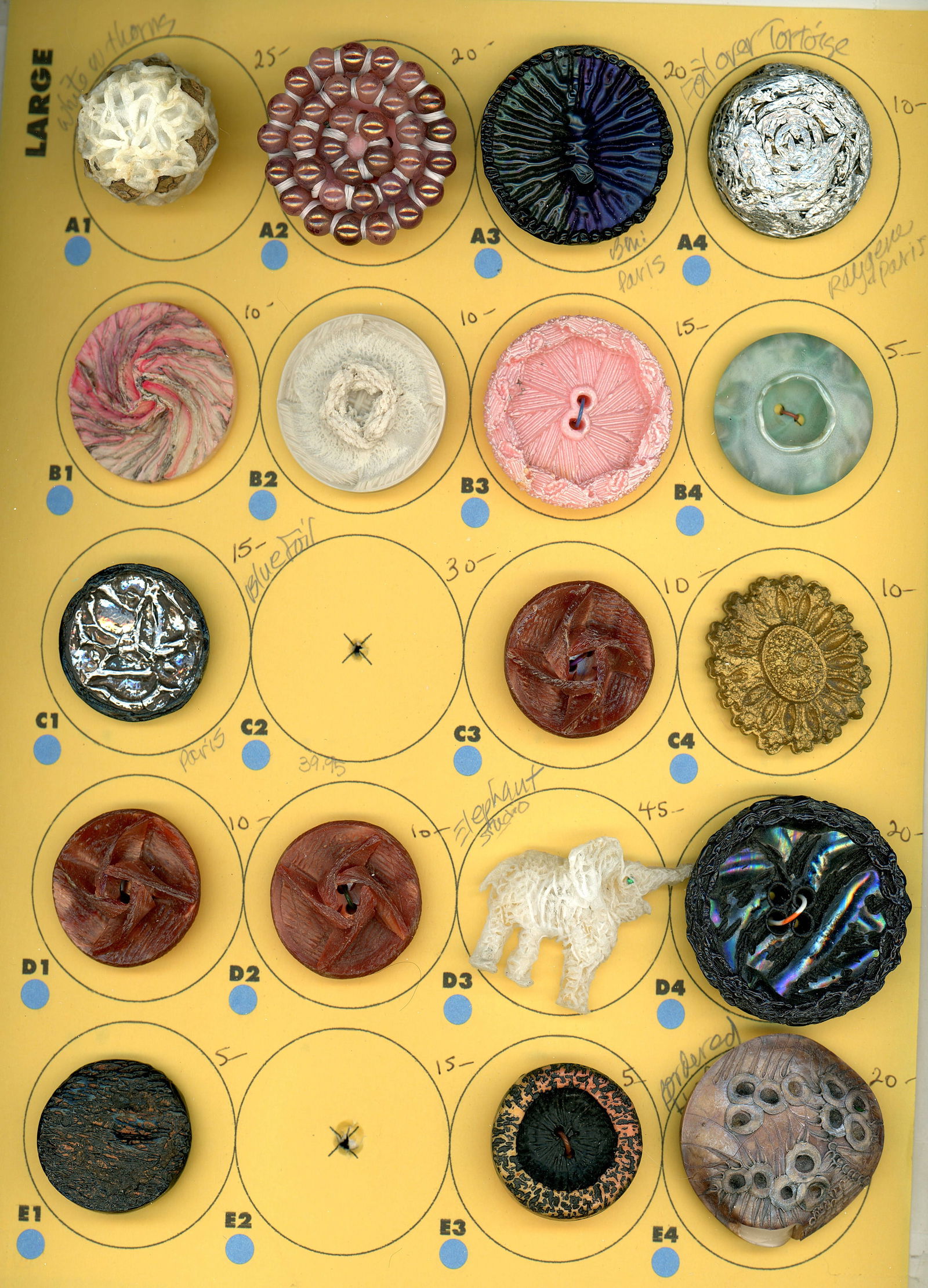 A CARD OF DIVISION THREE COUTURE STUDIO BUTTON: 18 Large 20th C. assorted crafted Couture buttons. DimensionsSM=Less than 3/4", Medium=3/4" to 1 1/4". Large=1 1/4" and above, extra large=1 3/4" and above Date or EraDIVISION 1=PRE 1918 AND DIVISION