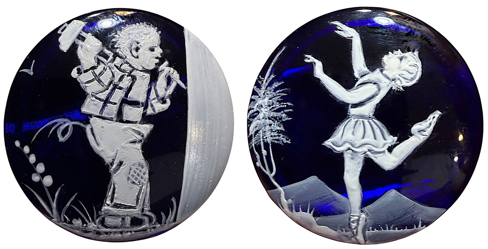 A SMALL CARD OF MARY GREGORY STYLE GLASS BUTTONS: 2 Large enamel decorated glass 21st C. cobalt children buttons. DimensionsSM=Less than 3/4", Medium=3/4" to 1 1/4". Large=1 1/4" and above, extra large=1 3/4" and above Date or EraDIVISION 1=PRE