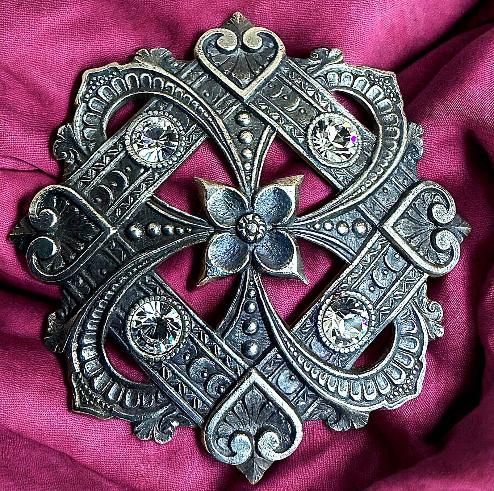 A DIVISION ONE PIERCED BRASS AND PASTE JEWEL BUTTON: 1 Large 19th century example with an ornate setting & hearts. DimensionsSM=Less than 3/4", Medium=3/4" to 1 1/4". Large=1 1/4" and above, extra large=1 3/4" and above Date or EraDIVISION 1=PRE 1918 AN