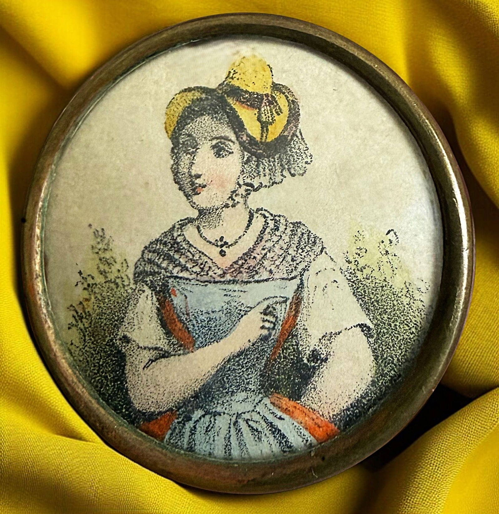 A DIVISION ONE HAND COLORED LITHO BUTTON: 1 Large late 19th century female figural example. DimensionsSM=Less than 3/4", Medium=3/4" to 1 1/4". Large=1 1/4" and above, extra large=1 3/4" and above Date or EraDIVISION 1=PRE 1918 AND DIVISION 3