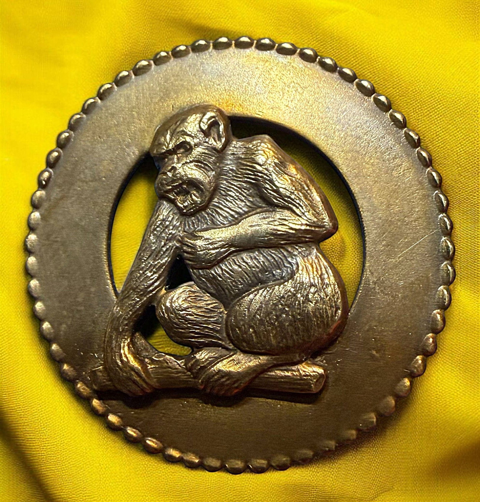 A DIVISION THREE STUDIO ARTIST BUTTON: 1 Large pierced 21st century monkey button. DimensionsSM=Less than 3/4", Medium=3/4" to 1 1/4". Large=1 1/4" and above, extra large=1 3/4" and above Date or EraDIVISION 1=PRE 1918 AND DIVISION 3 IS AF