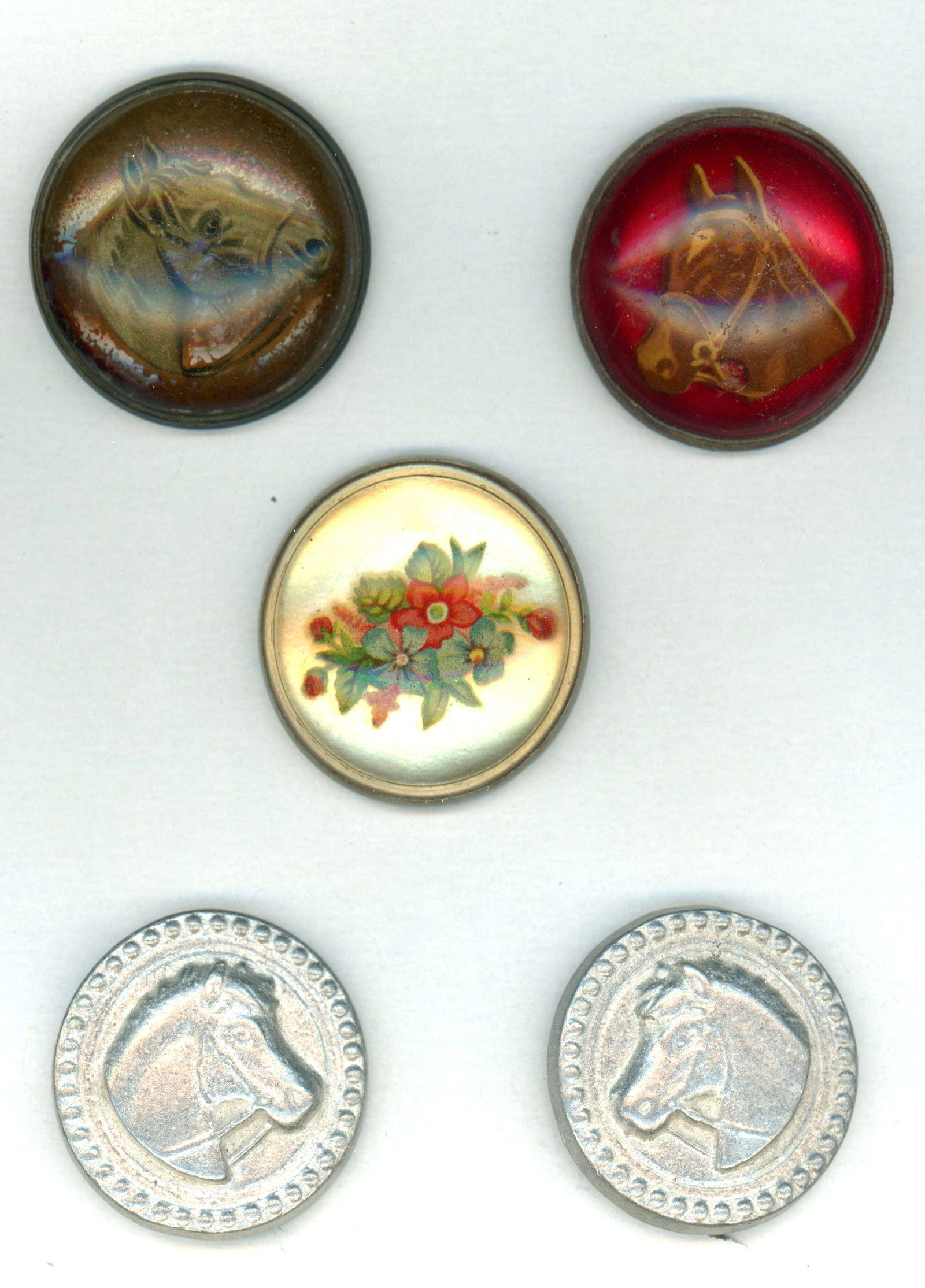 A SMALL CARD OF HORSE BRIDAL ROSETTES: 5 Large early 20th Century mostly with Horse designs. DimensionsSM=Less than 3/4", Medium=3/4" to 1 1/4". Large=1 1/4" and above, extra large=1 3/4" and above Date or EraDIVISION 1=PRE 1918 AND DIVISI