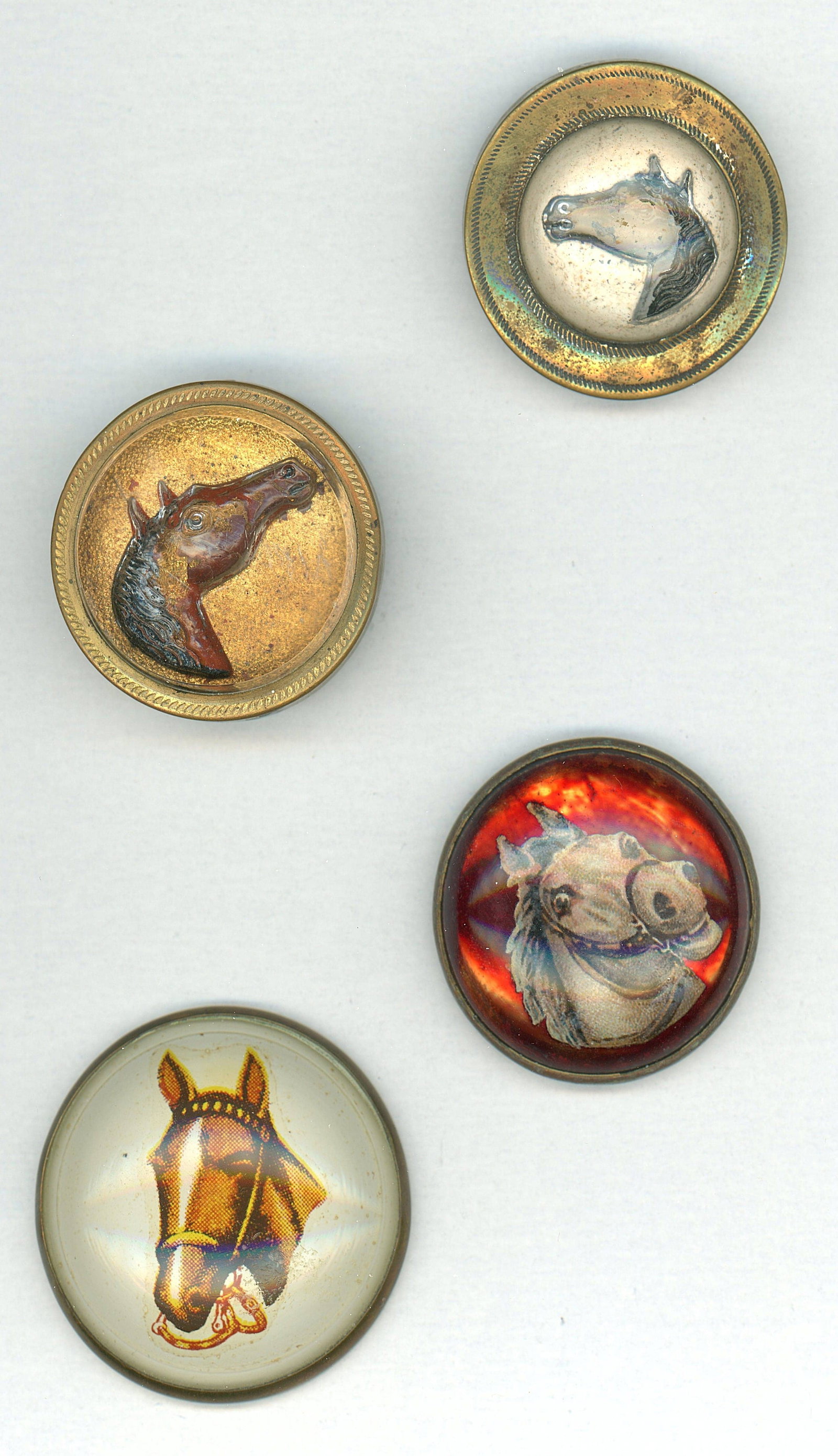 A SMALL CARD OF HORSE BRIDAL ROSETTES: 5 Large early 20th Century mostly with Horse designs. DimensionsSM=Less than 3/4", Medium=3/4" to 1 1/4". Large=1 1/4" and above, extra large=1 3/4" and above Date or EraDIVISION 1=PRE 1918 AND DIVISI