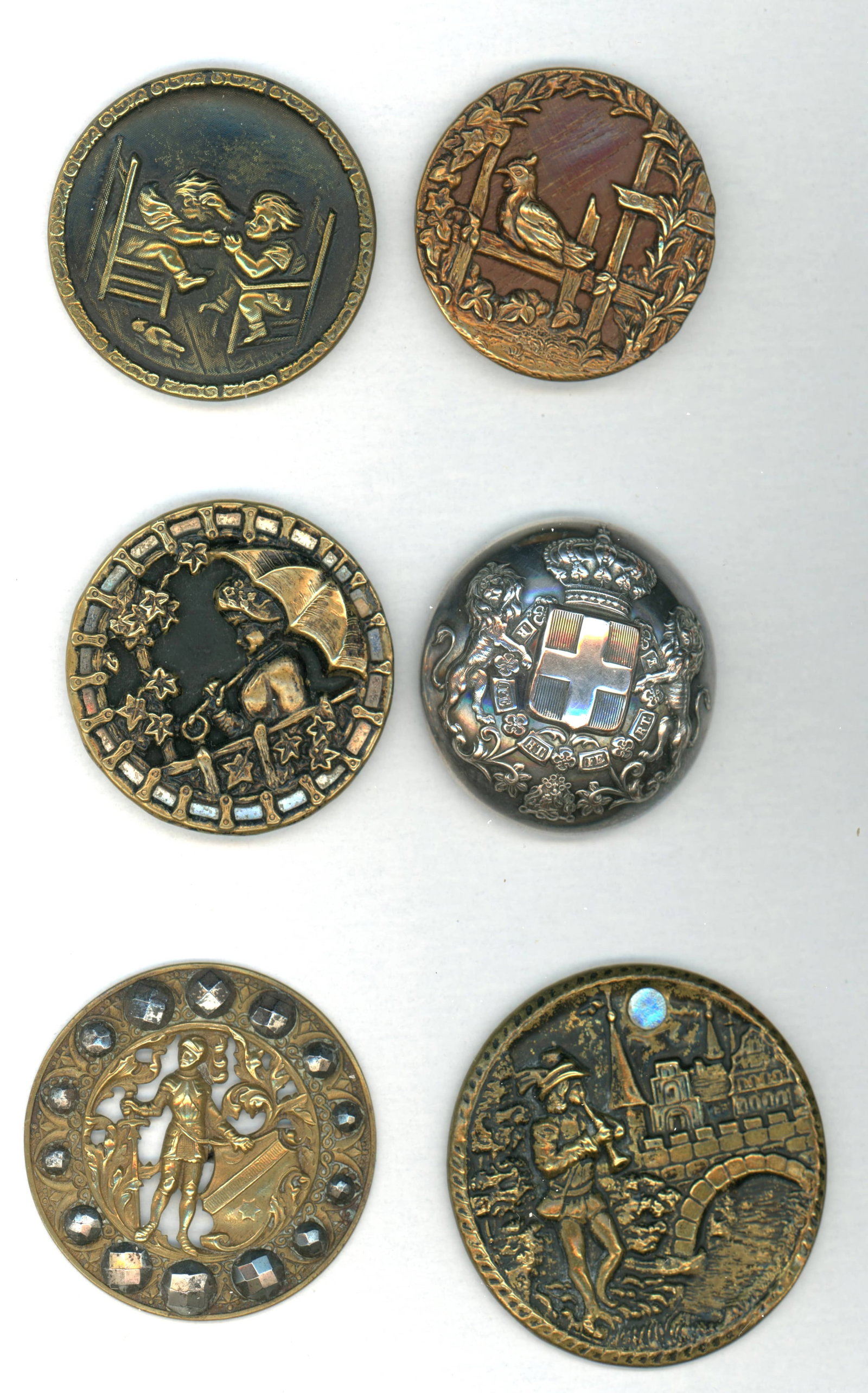A SMALL CARD OF DIVISION ONE METAL BUTTONS: 6 Medium/Large 19th century examples including pictorials. This lot includes the scarce Hair pulling example with the doll, the Pied Piper of Hamlin, a fabulous pictorial silver domed Livery example,