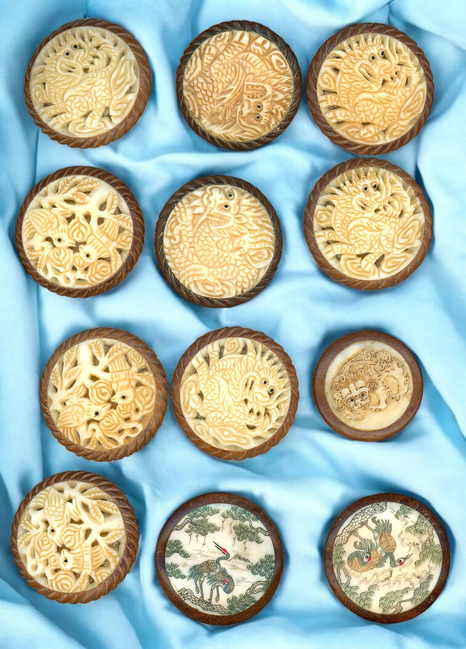 A SELECTION OF DIVISION THREE BONE IN WOOD BUTTONS: 12 Large 21st century carved animal examples. DimensionsSM=Less than 3/4", Medium=3/4" to 1 1/4". Large=1 1/4" and above, extra large=1 3/4" and above Date or EraDIVISION 1=PRE 1918 AND DIVISION 3 IS