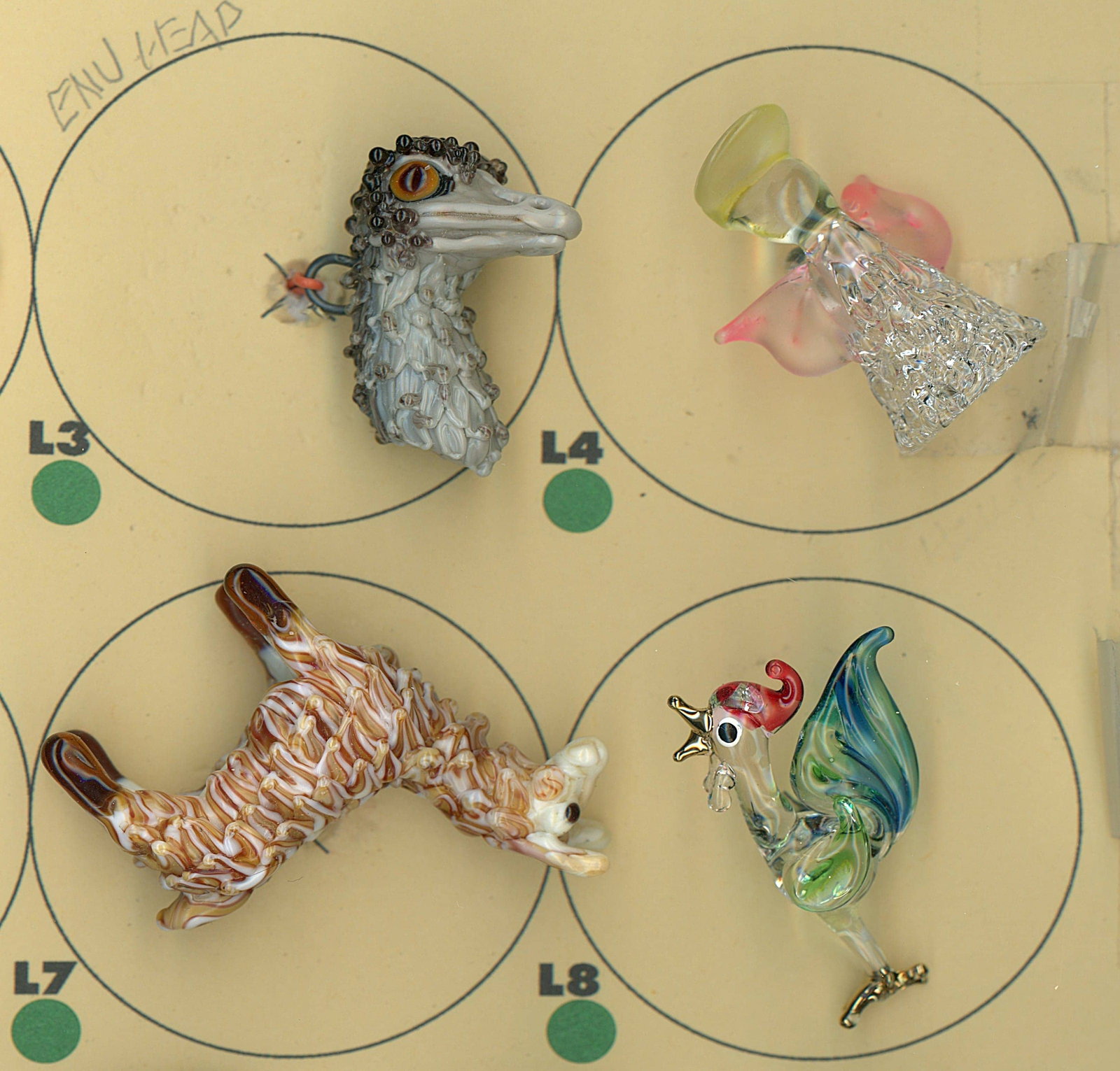 A PARTIAL CARD OF DIVISION THREE GLASS BUTTONS: 4 Large 20th/21st century colorful lampwork examples. DimensionsSM=Less than 3/4", Medium=3/4" to 1 1/4". Large=1 1/4" and above, extra large=1 3/4" and above Date or EraDIVISION 1=PRE 1918 AND DIVISI