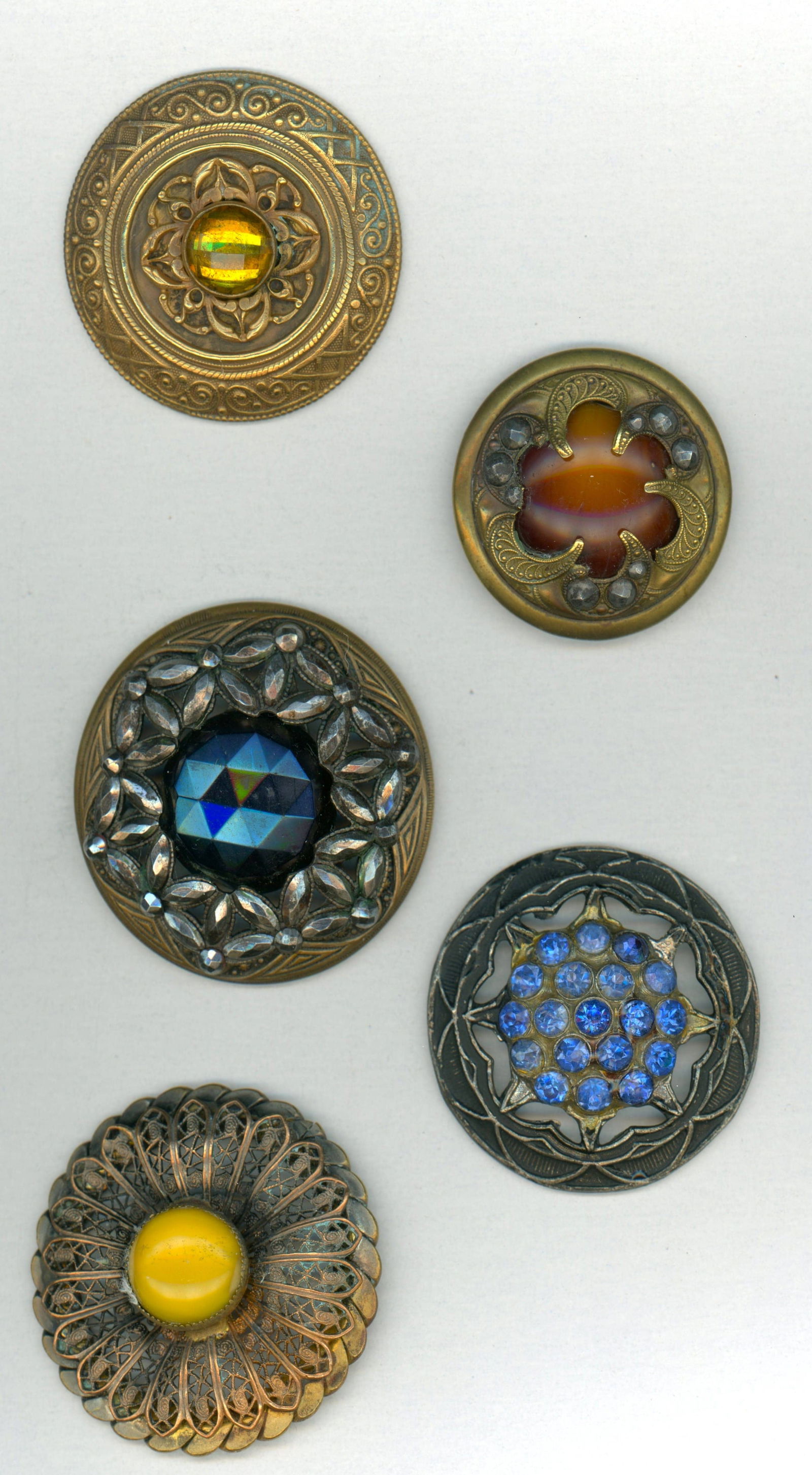 A SMALL CARD OF DIVISION ONE LARGE JEWLED BUTTONS: 5 Large 19th-early 20th C. Examples including Gay 90. DimensionsSM=Less than 3/4", Medium=3/4" to 1 1/4". Large=1 1/4" and above, extra large=1 3/4" and above Date or EraDIVISION 1=PRE 1918 AND DIVISI