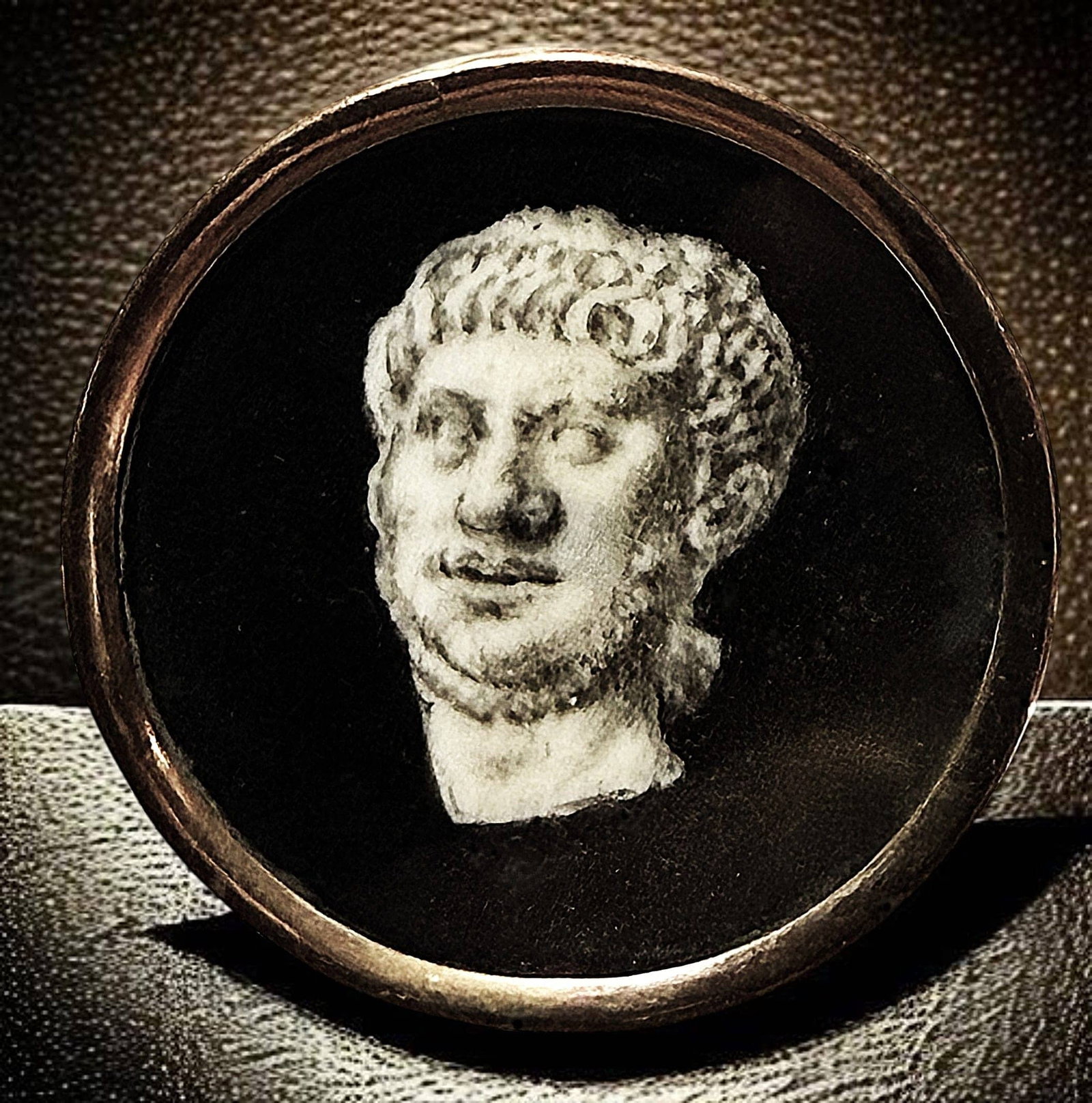 A DIVISION ONE PAINTING UNDER GLASS BUTTON: 1 Large 18th century En Grisaille example. This nicely detailed version of a Grecian bust was hand painted in the En Grisaille technique on natural material and set under glass with a copper rim and