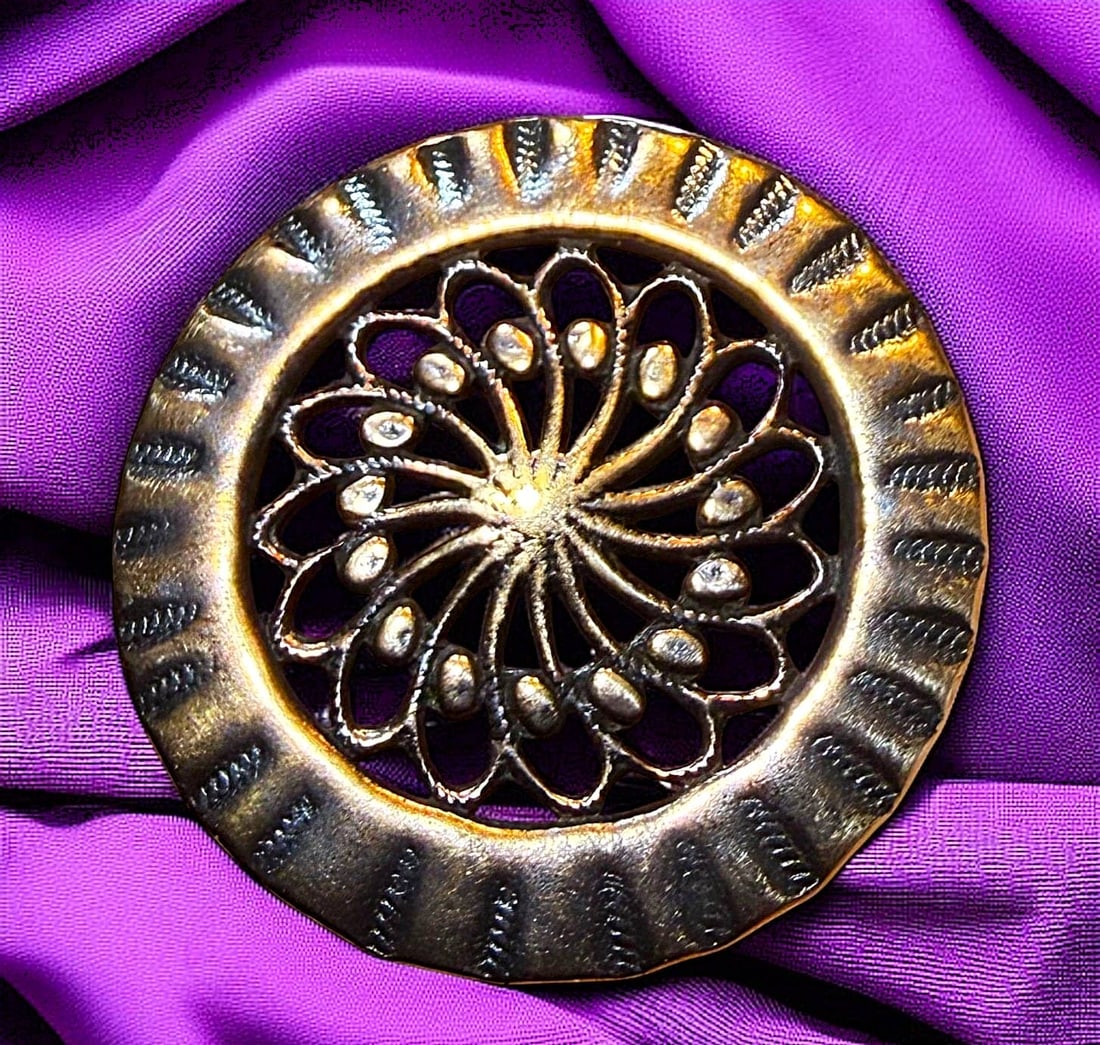 A DIVISION ONE HAND TOOLED COPPER BUTTON: 1 Large-Med. 18th C. pierced copper button with a tooled border. DimensionsSM=Less than 3/4", Medium=3/4" to 1 1/4". Large=1 1/4" and above, extra large=1 3/4" and above Date or EraDIVISION 1=PRE 1918