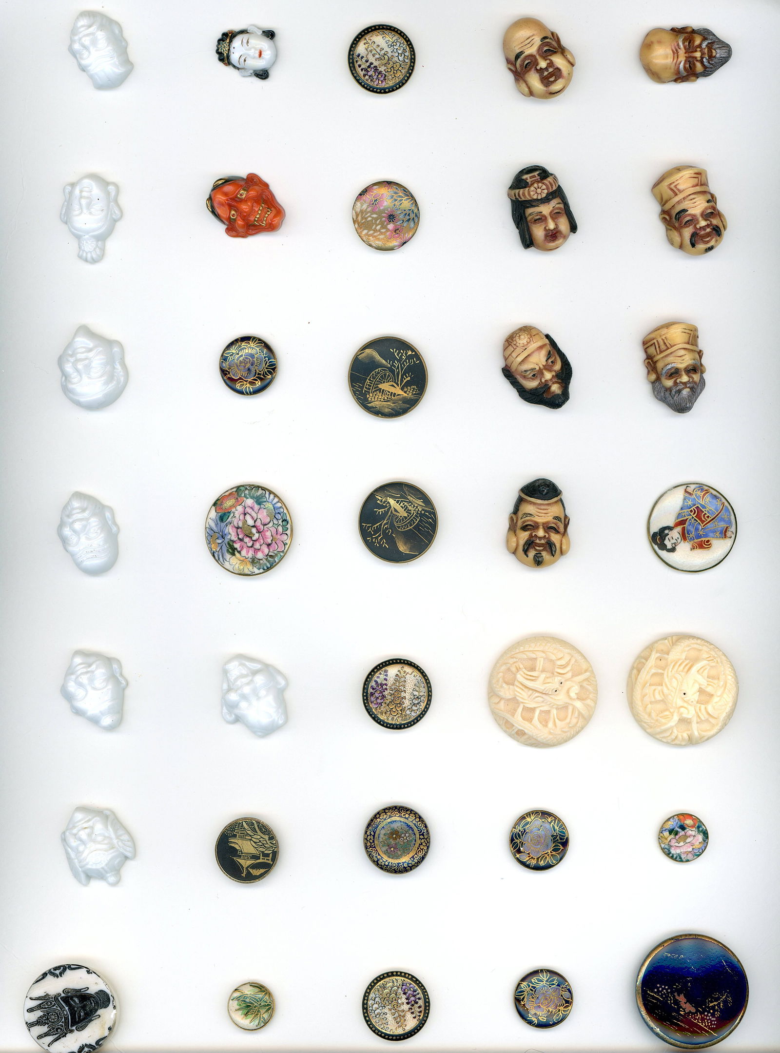 A CARD OF DIVISION 1 & 3 ASIAN THEMED BUTTONS: 35 Medium/Small 19th/20th century examples including Arita. DimensionsSM=Less than 3/4", Medium=3/4" to 1 1/4". Large=1 1/4" and above, extra large=1 3/4" and above Date or EraDIVISION 1=PRE 1918 AND