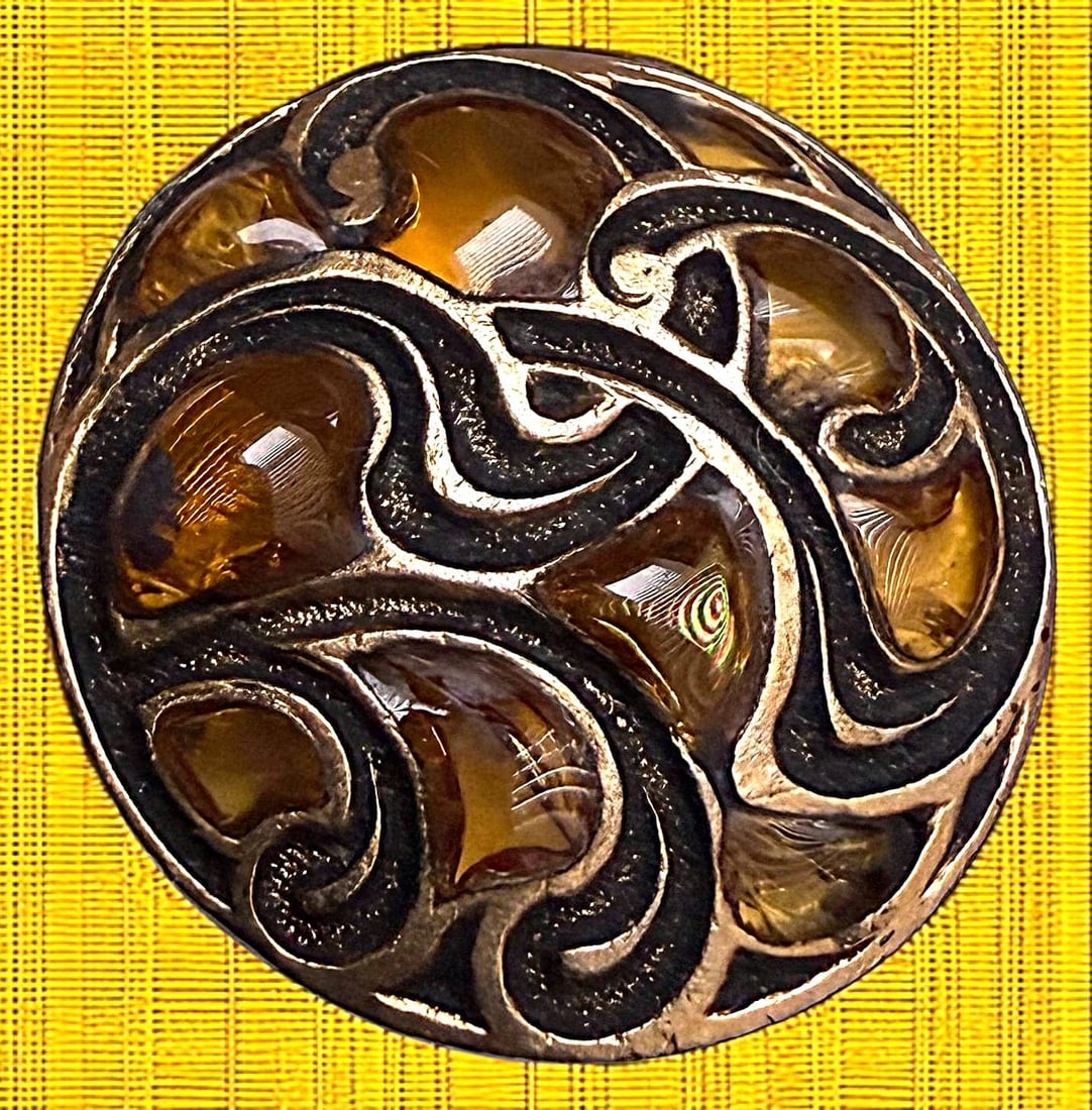 A DIVISION THREE PLIQUE A JOUR ENAMEL BUTTON: 1 Medium size 20th century amber colored example. DimensionsSM=Less than 3/4", Medium=3/4" to 1 1/4". Large=1 1/4" and above, extra large=1 3/4" and above Date or EraDIVISION 1=PRE 1918 AND DIVISION 3