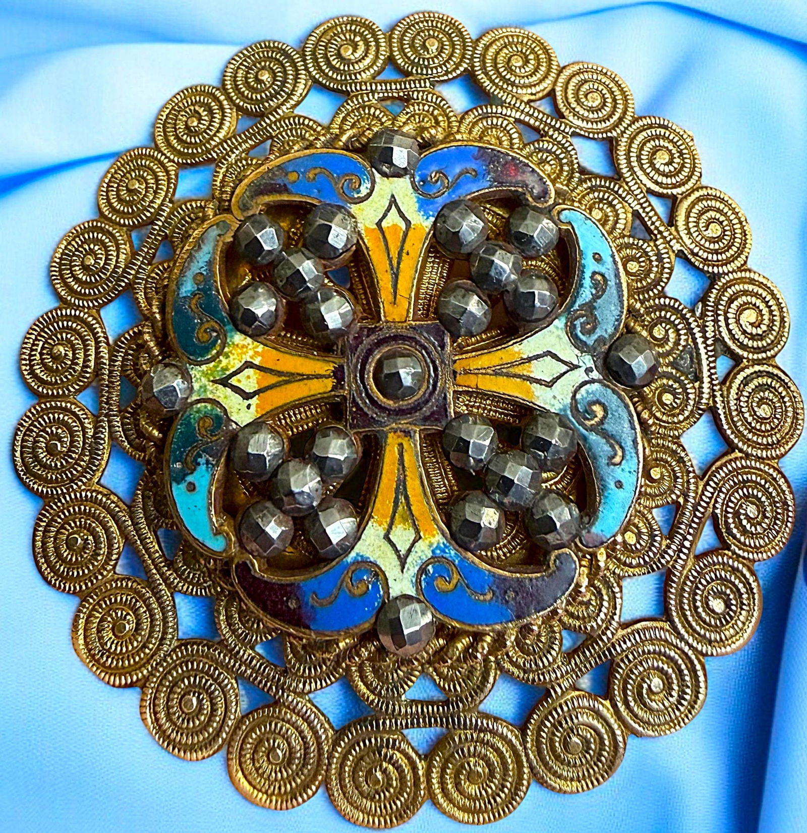 A DIVISION ONE PIERCED BUTTON ENAMEL PLAQUETTE: 1 Extra Large 19th century colorful example on a brass setting. DimensionsSM=Less than 3/4", Medium=3/4" to 1 1/4". Large=1 1/4" and above, extra large=1 3/4" and above Date or EraDIVISION 1=PRE 1918