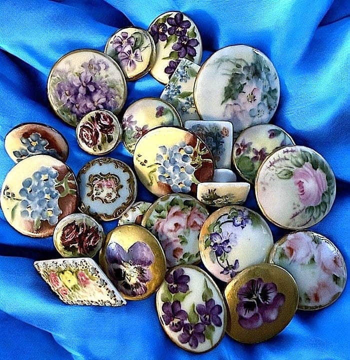 A BAG LOT OF DIVISION 1 HAND PAINTED PORCELAIN BUTTONS: This large selection of early 20th century are stud examples. DimensionsSM=Less than 3/4", Medium=3/4" to 1 1/4". Large=1 1/4" and above, extra large=1 3/4" and above Date or EraDIVISION 1=PRE 1918 AN
