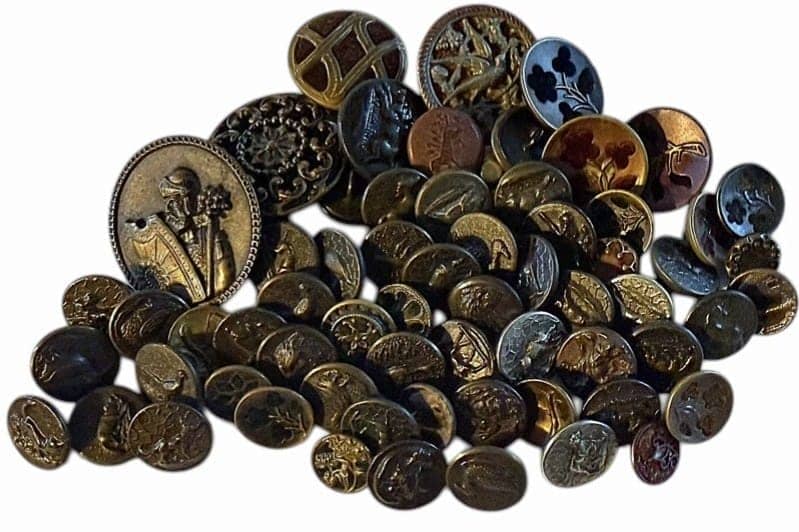 A BAG LOT OF DIVISION ONE METAL PICTURE BUTTONS: A nice selection of assorted pictorial examples including PERFUME. DimensionsSM=Less than 3/4", Medium=3/4" to 1 1/4". Large=1 1/4" and above, extra large=1 3/4" and above Date or EraDIVISION 1=PRE 19