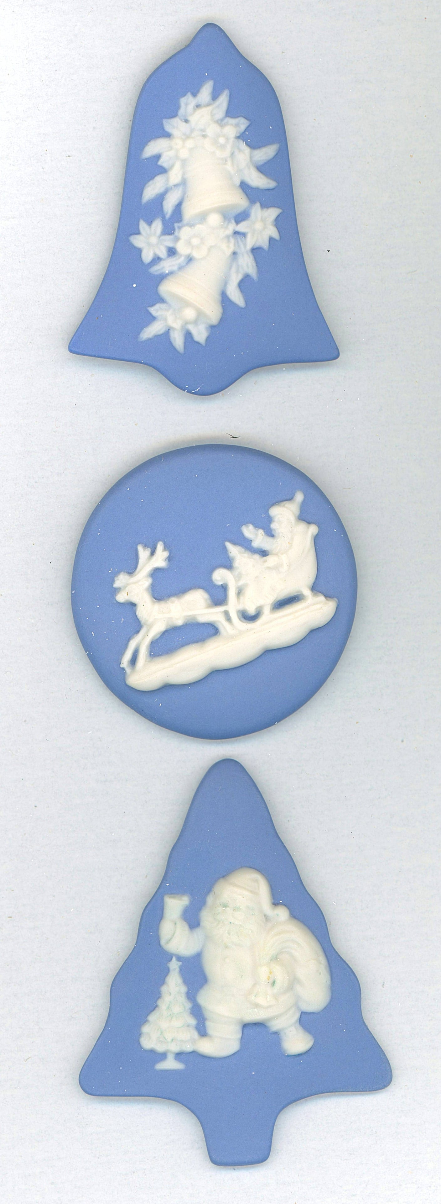 A SMALL CARD OF DIVISION THREE STUDIO ARTIST BUTTONS: 3 EX-Large 20th century blue Jasperware examples by Rzanski. The buttons on this small card are all dated 2004 and depict various Christmas scenes. Some nice shapes too. DimensionsSM=Less than 3/4", M