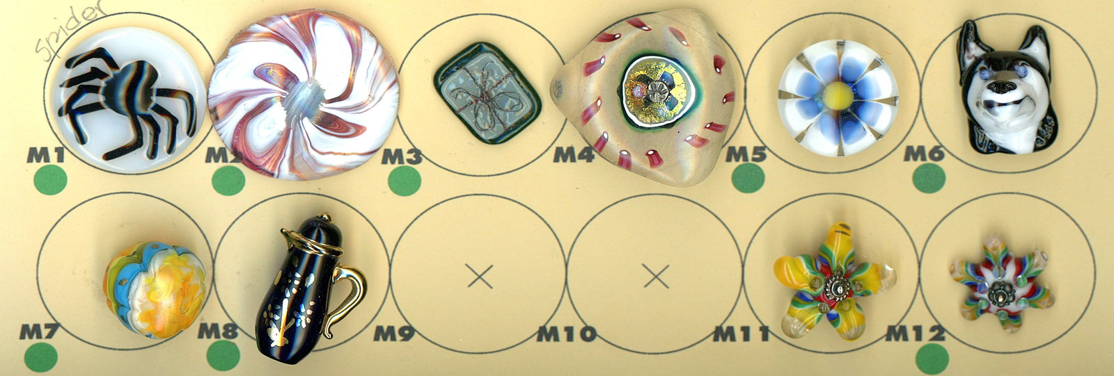 A PARTIAL CARD OF DIVISION THREE GLASS BUTTONS: 10 Medium/Large 20th/21st century colorful lampwork examples. This fun lot from the eclectic collection of Nikki Deal includes a variety of subject matter in realistic shapes and colorful lampwork and