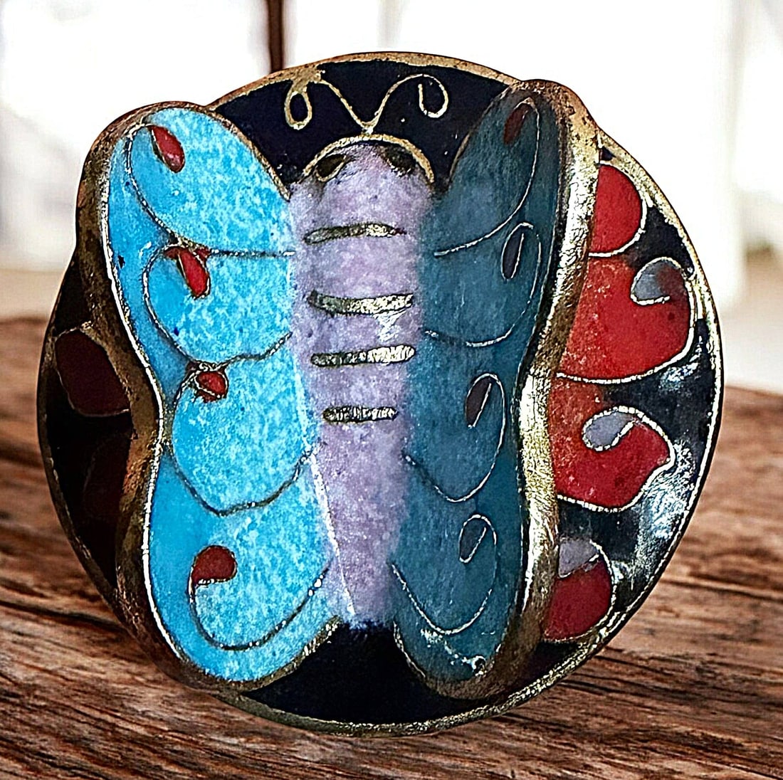 A DIVISION THREE ENAMEL ANIMAL BUTTON: 1 Large 20th century three dimensional butterfly example. This heavy and finely detailed cloissonne enamel button was produced in China in the late 1990's and is very colorful. Nikki Deal used this bu