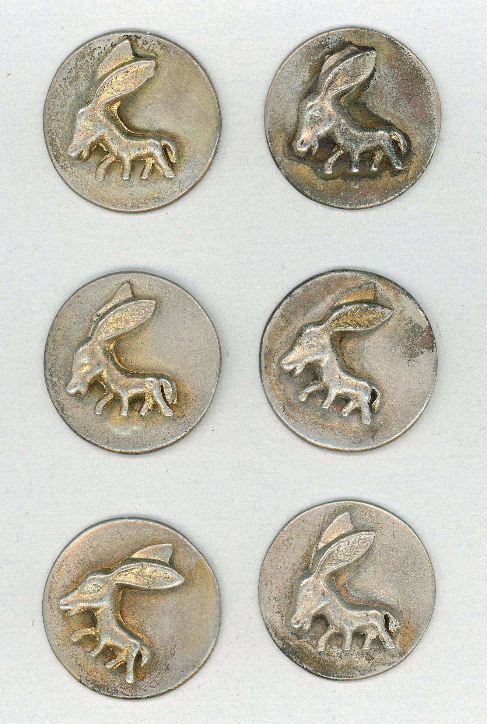 A SMALL CARD OF MATCHING METAL ANIMAL BUTTONS (1 of 3)