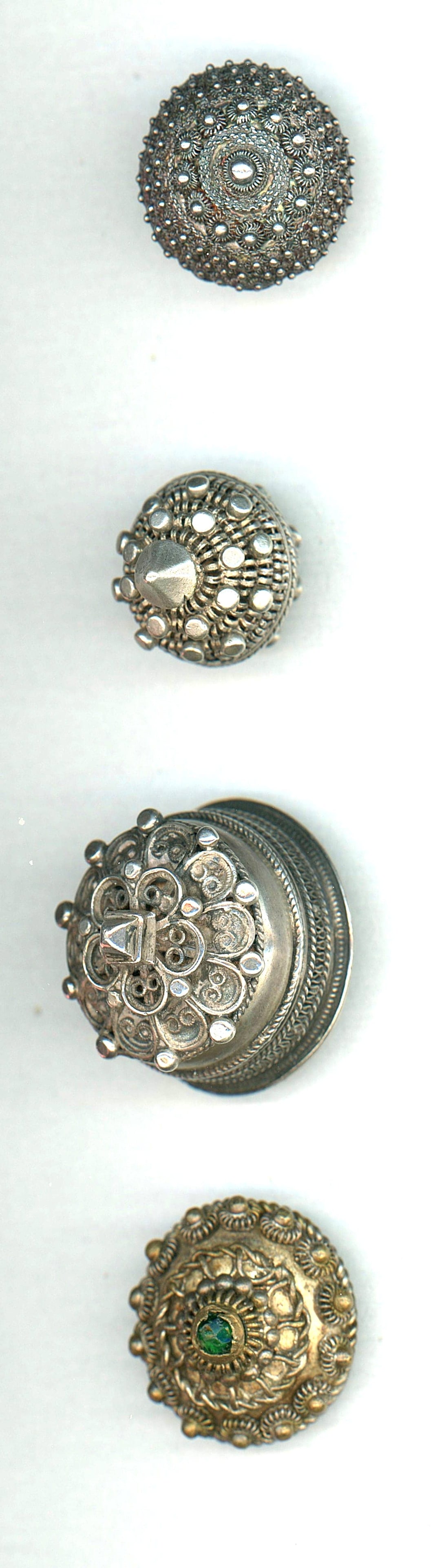 A SMALL CARD OF DIVISION ONE PEASANT SILVER BUTTONS: 4 Medium/Large Medium 19th century examples including jeweled. Here is a nice selection of these desirable buttons by collectors. The lot includes a wonderful heavy thick example, a nice gilded