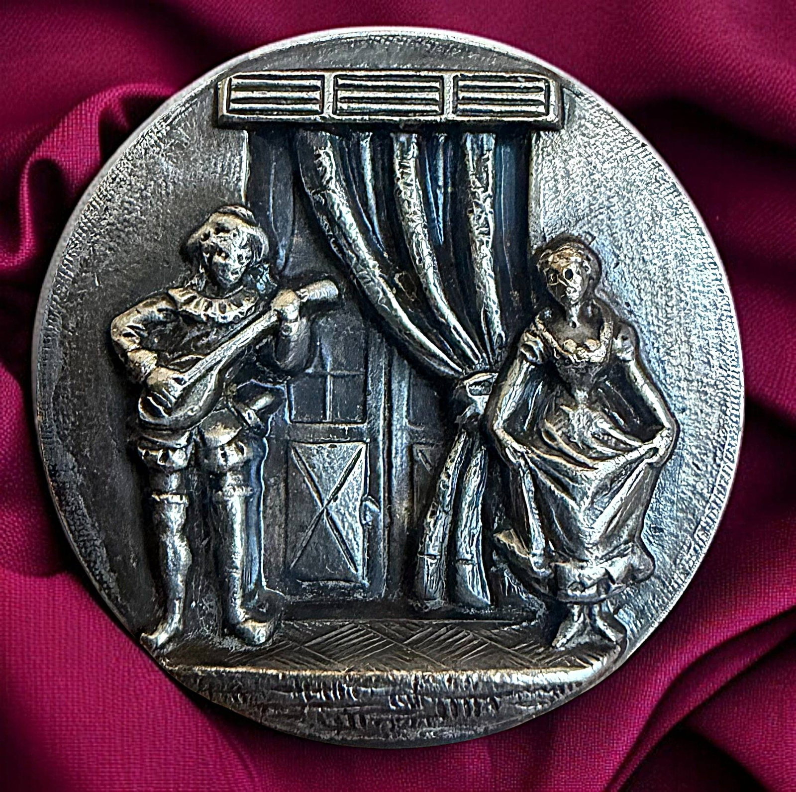 A DIVISION ONE SILVERED PICTORIAL FIGURAL BUTTON: 1 Large medium late 19th C. "Scaramouche and Columbine" example. This is a beautifully detailed in relief example. Scaramouche is serenading Columbine. A truly romantic scene. An example like this rec