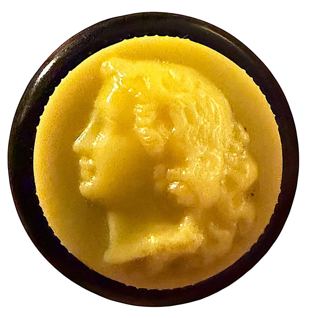 A DIVISON THREE TWO PART COLT BUTTON: 1 Medium 20th C, rouge button from the Colt Manufacturing Co. These Rouge buttons are very desirable among collectors. This example has a yellow screw on cap with the typical molded ladies head and a