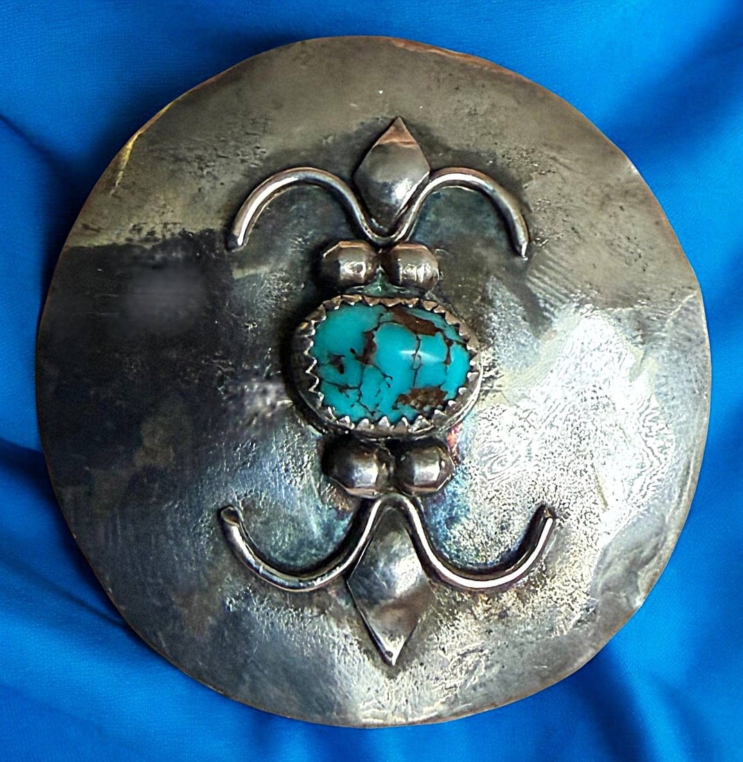A DIVISION THREE SILVER AND TURQUOISE BUTTON: 1 Large 20th century example hand made by Kayo. Here is a silver button handcrafted by the artist Kayo. Set with a shaped and beautiful turquoise stone. DimensionsSM=Less than 3/4", Medium=3/4" to 1 1