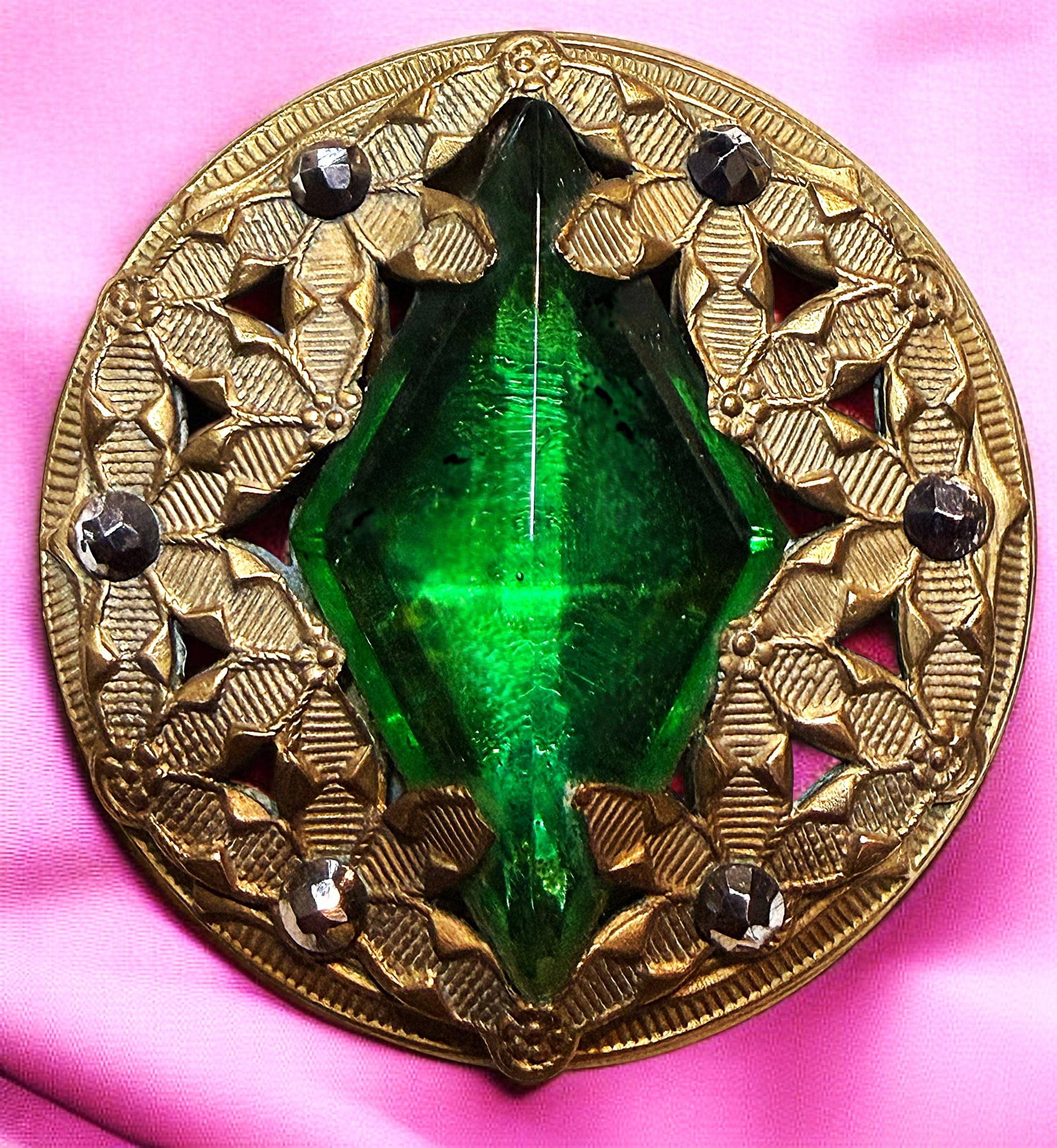 A DIVISION ONE VICTORIAN JEWELED BUTTON: 1 Large 19th century pierced brass GAY 90 example. Here is a lovely example of genuine Gay 90 jeweled button from the 1890's. The pierced ornate brass example is centered with a large faceted diamond