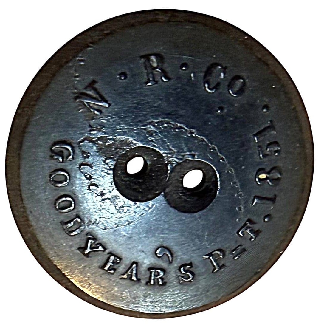 A DIVISION ONE BACKMARKED RUBBER BUTTON - 2