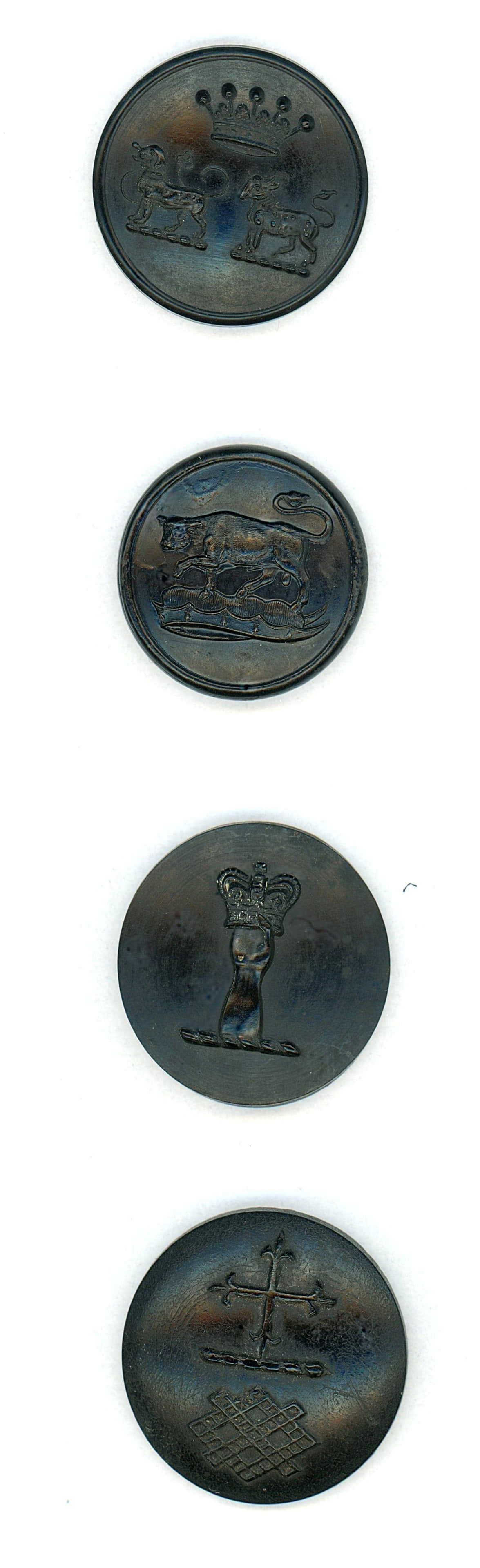 A SMALL CARD OF DIVISION ONE LIVERY BUTTONS: 4 Medium 19th century horn crest buttons including a COW. This lot includes a DOUBLE horn crest with two animals and a crown, a great cow, a cross with what appears to Fleur de Lis, and a hand holding