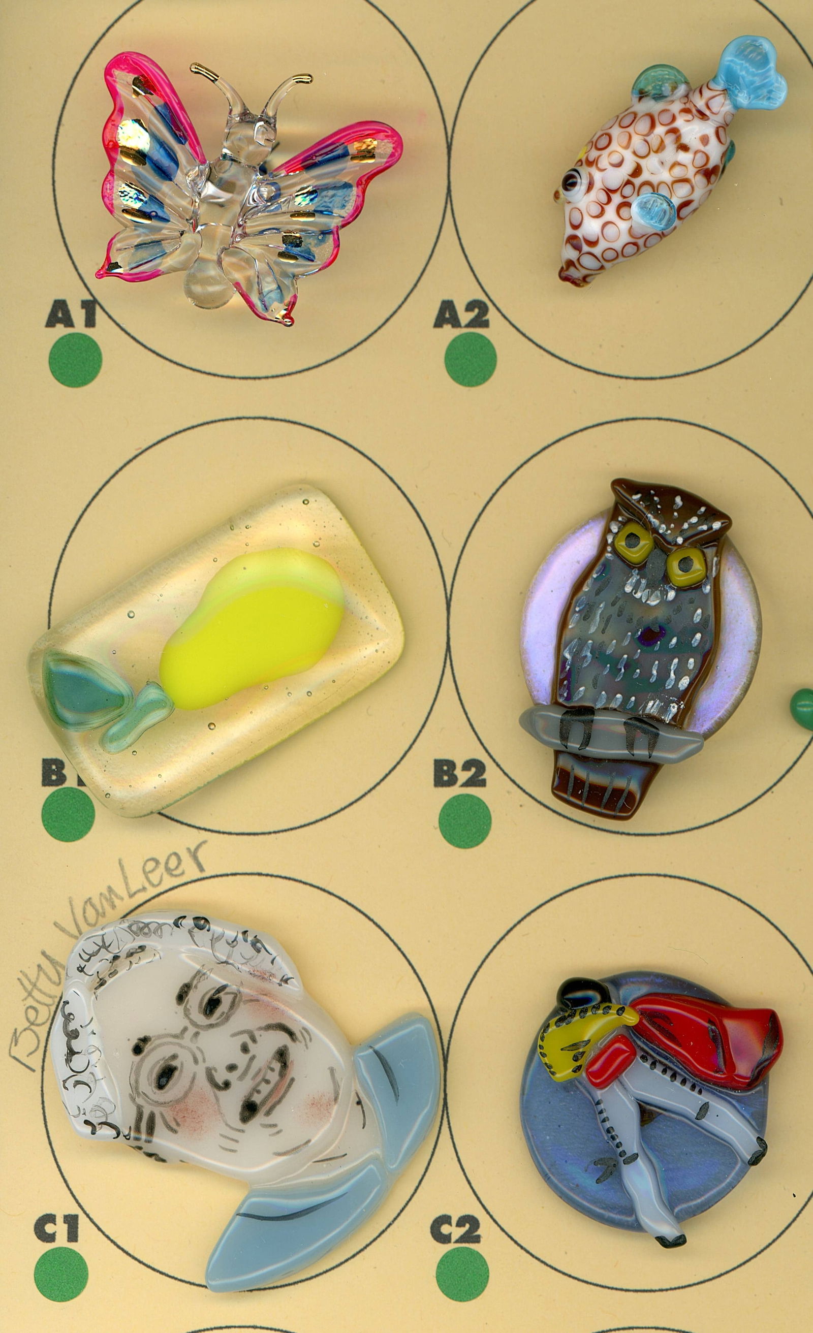 A PARTIAL CARD OF DIVISION THREE GLASS BUTTONS (1 of 4)