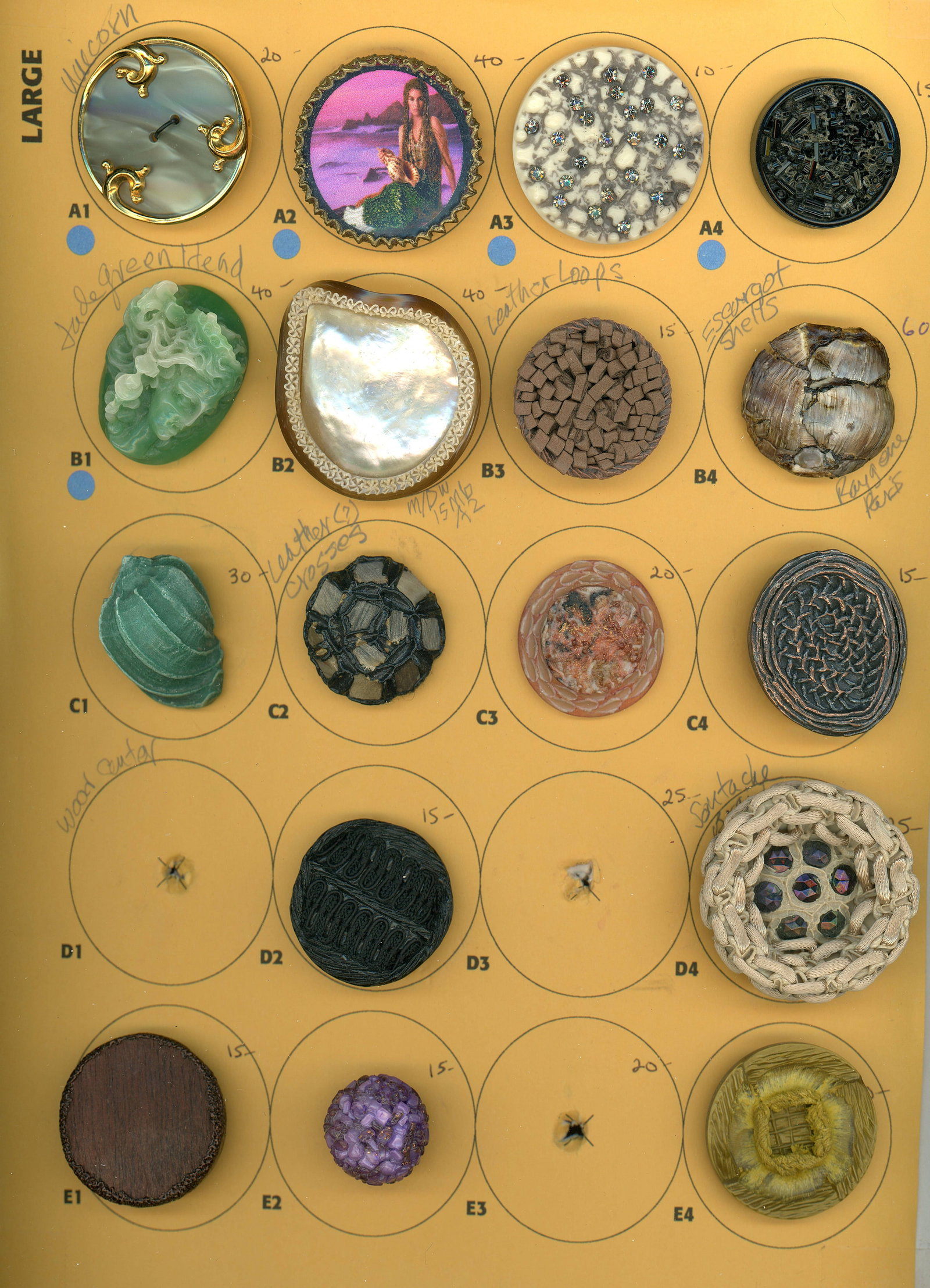 A CARD OF DIVISION THREE COUTURE STUDIO BUTTON: 17 Medium/Large 20th C. assorted crafted Couture buttons. To be honest here we are not experts in this area of button collecting. These Couture examples are a specialty of some collectors and you are