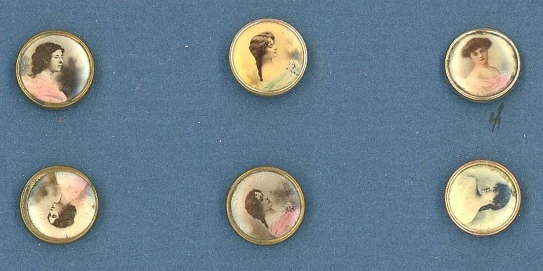 A SMALL CARD OF DIVISION ONE LITHO BUTTONS: 6 Small 19th century examples in the Birmingham trade style. This small card is for those buttons that are similar to the mountings used on Birmingham trade buttons and are centered with a lithograph
