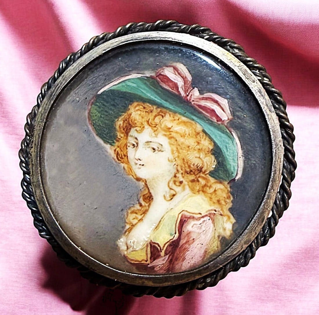 A DIVISION ONE HAND PAINTING UNDER GLASS BUTTON: 1 Large medium 19th century painting on natural material example. Just look at the expression on this young women's face, I wonder what she was thinking at the time of this rendition. The colors and f