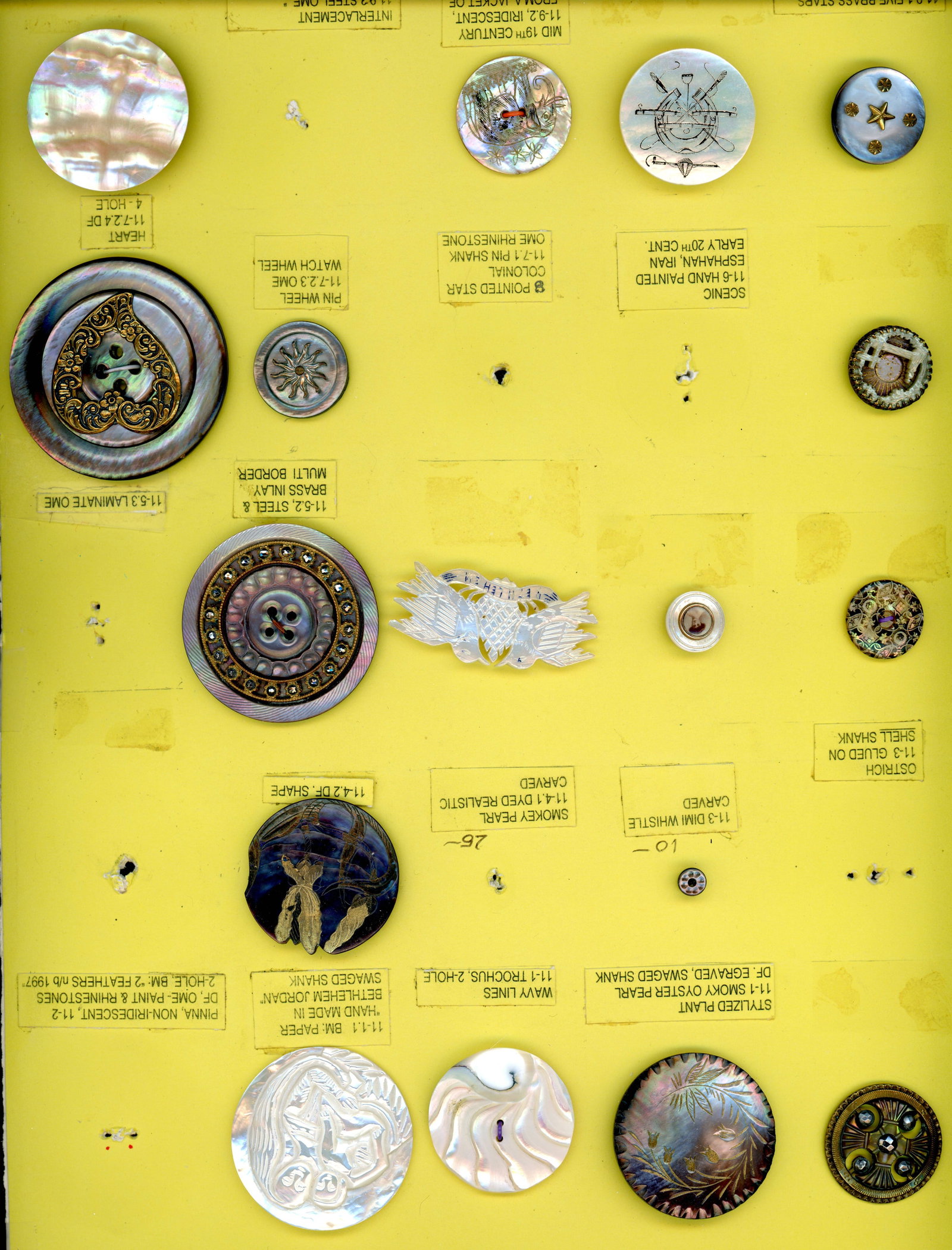 A PARTIAL CARD OF DIVISION 1 & 3 PEARL BUTTONS: 17 S/M/L 19th/20th century assorted technique examples. This card includes a nice carved Bethlehem pearl figural, a great Coachmen's style engraved and pigmented riding crop and helmet example. A nice