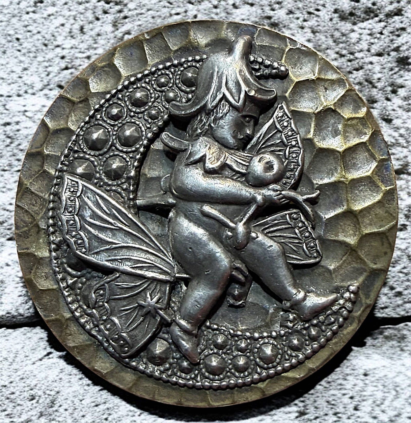 A DIVISION ONE PEWTER AND BRASS PICTORIAL BUTTON: 1 Extra Large 19th century example of Tom Thumb riding a butterfly. I have always loved this hand hammered silvered brass background button with a pewter escutcheon of Tom Thumb riding a butterfly all