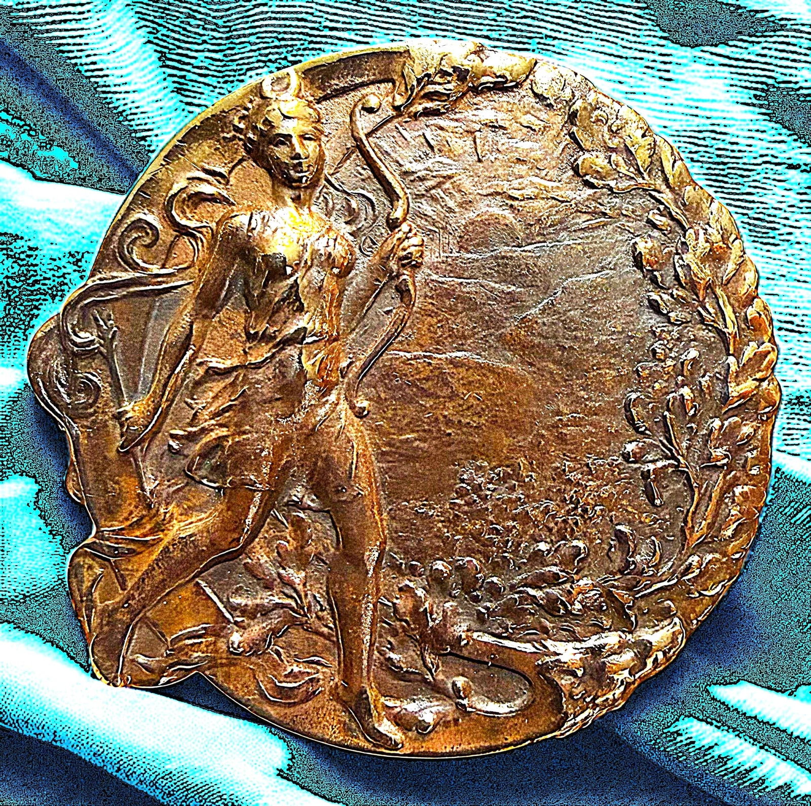 A DIVISIOJ ONE PICTORIAL LOW RELIEF FIGURAL BUTTON: 1 Large early 20th century copper colored brass button with detail. This highly detailed Art Nouveau design in low relief is finely crafted and depicts a beautiful full figured women. DimensionsSM=Les