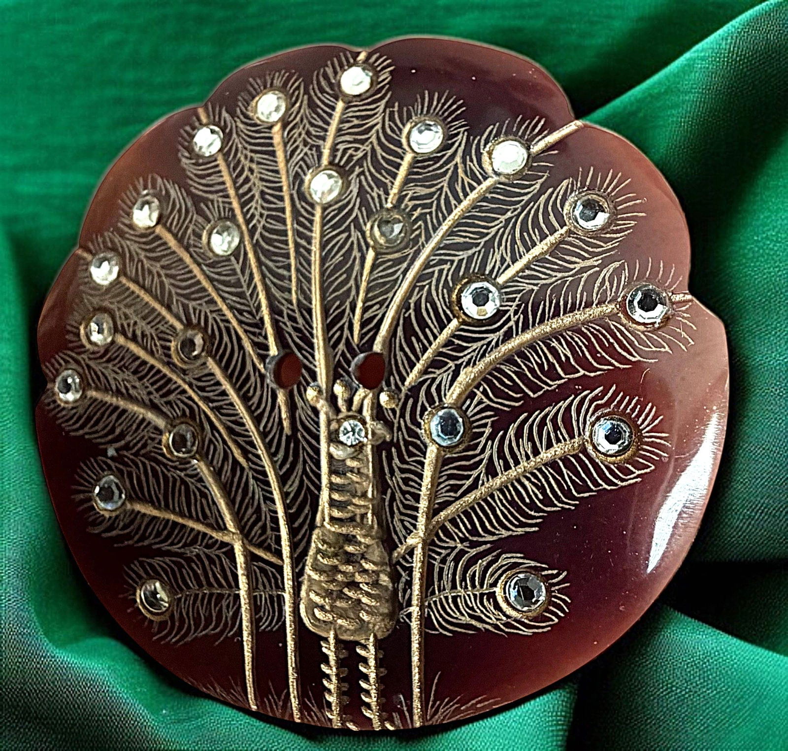 A DIVISION THREE STUDIO ARTIST BUTTON: 1 Large engraved Pin Shell Peacock by Nancy Dubois of New Jersey. We have stated this in previous auctions that Nancy is one of the very talented artists that the button world has had the pleasure of