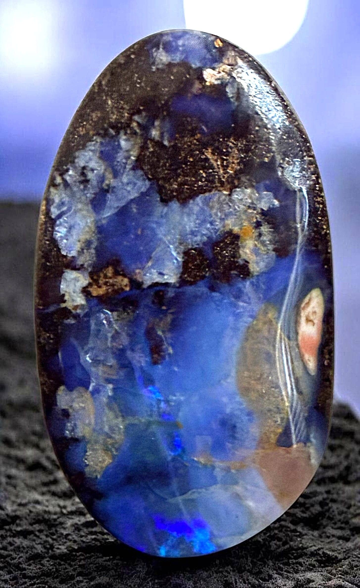 A DIVISION THREE INCREDIBLE GEMSTONE BUTTON: 1 Large 20th century multi colored Boulder OPAL example. This highly prized natural and very durable variety of Opal gemstones comes from the Cretaceous rocks of Queensland Australia. These opals are