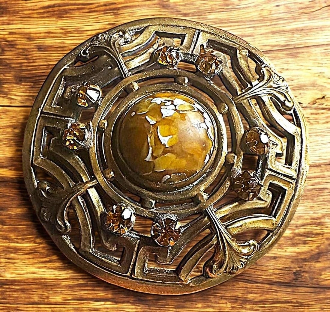 A DIVISION ONE LARGE ORNATE JEWELED BUTTON: 1 Large late 19th century Gay 90's example. Here is a beautiful and ornate detailed example of a genuine Gay 90 button. This example is a pierced openwork design with a large cabochon intermixed carme