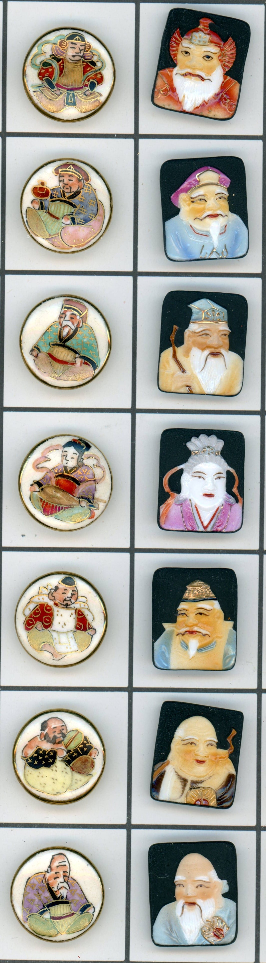 A SMALL CARD OF DIVISION THREE JAPANESE BUTTONS: 14 Medium 20th century Satsuma and Arita Examples. This lot includes a nice colorful set of Arita porcelain immortal gods from Japan along with a colorful set of Japanese Satsuma immortal gods set. Di