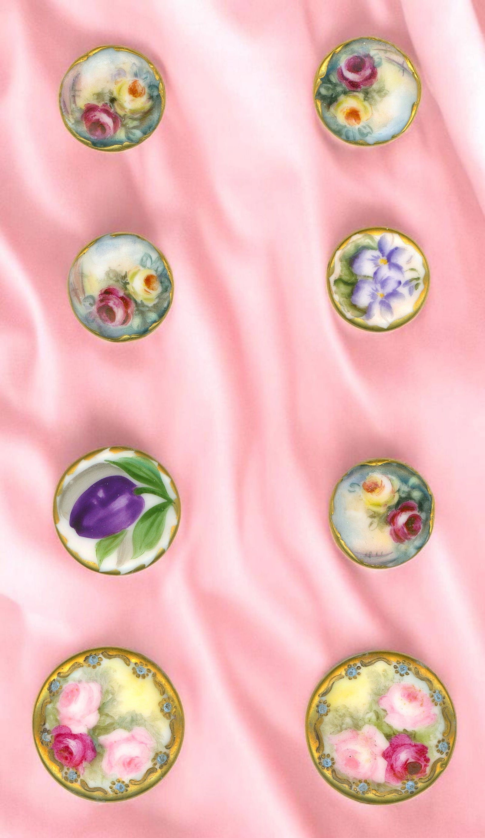 A SMALL CARD OF HAND PAINTED CERAMIC BUTTONS: 8 Medium/Large early 20th century floral Stud examples. Here we have 8 lovely hand painted examples of early 20th century porcelain work. The variety of colors and the variety of florals is outstandin