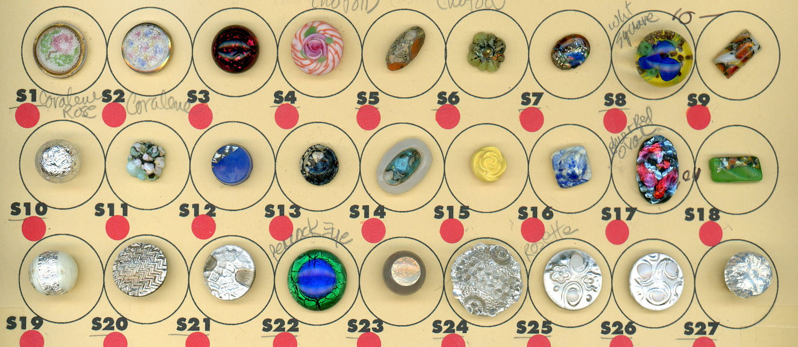 A PARTIAL CARD OF DIVISION ONE GLASS BUTTONS: 27 Small 19th century examples including Coralene. This selection includes 2 nice Coralene examples, a peacock eye glass example, popper glass and more. DimensionsSM=Less than 3/4", Medium=3/4" to 1