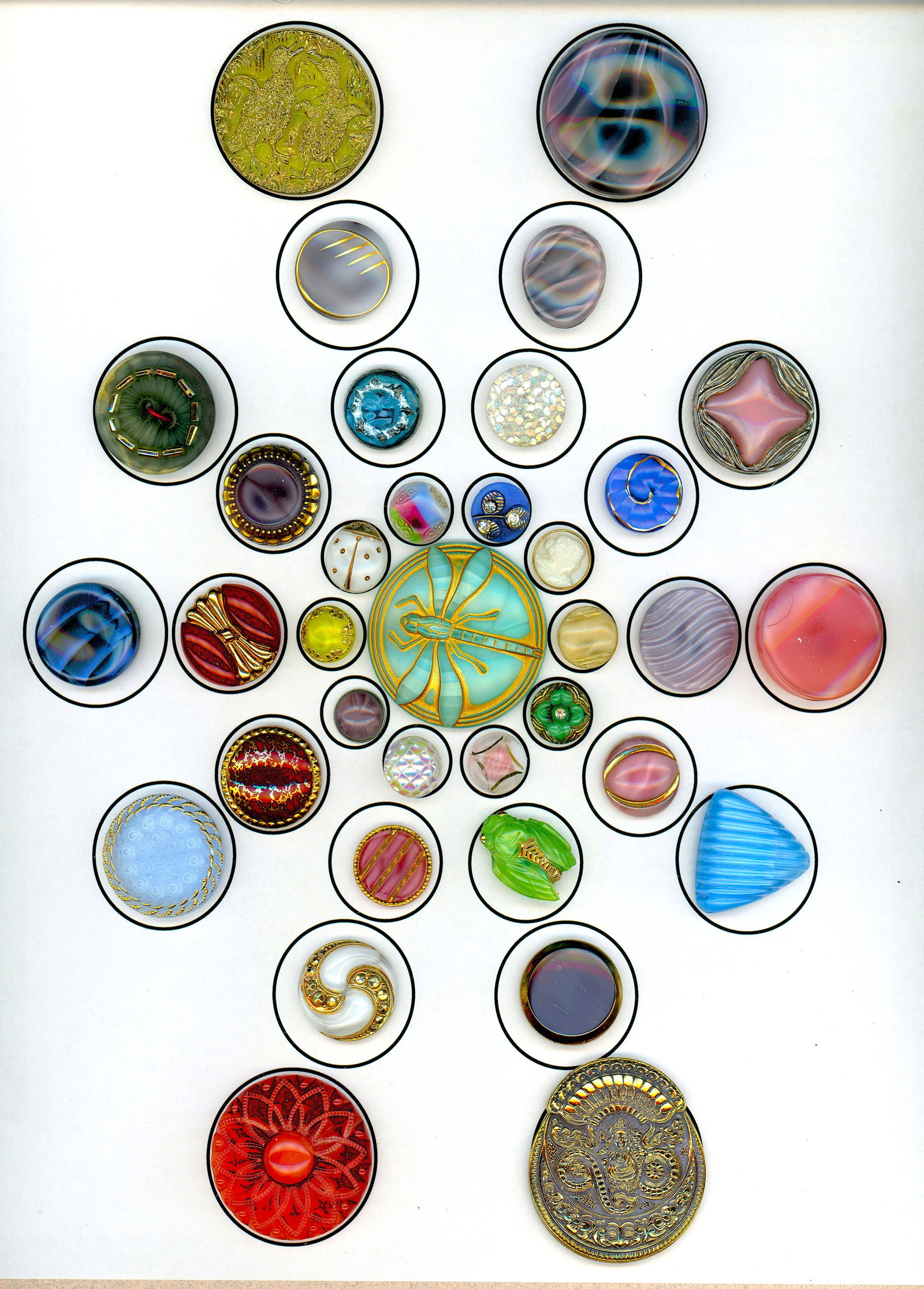 A CARD OF DIVISION THREE GLASS BUTTONS': 35 S/M/L 20th century examples including pictorials. Here is a very colorful glass card that Connie Robinson compiled. The card includes vintage moonglows, large Czech examples, shapes and a large ass
