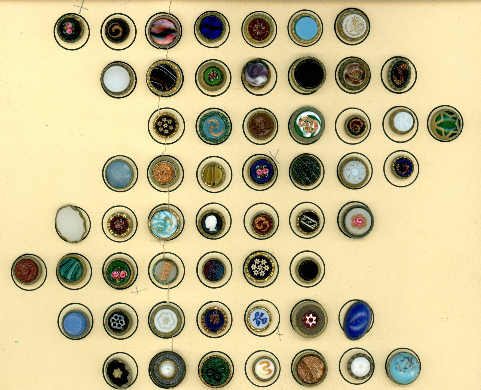 A CARD OF DIVISION ONE GLASS IN METAL BUTTONS: 56 Small 19th century assorted "Waistcoat " style examples. Here is a large and nice variety of colors, patterns, designs and more in these what collectors used to call Waistcoat buttons including Che