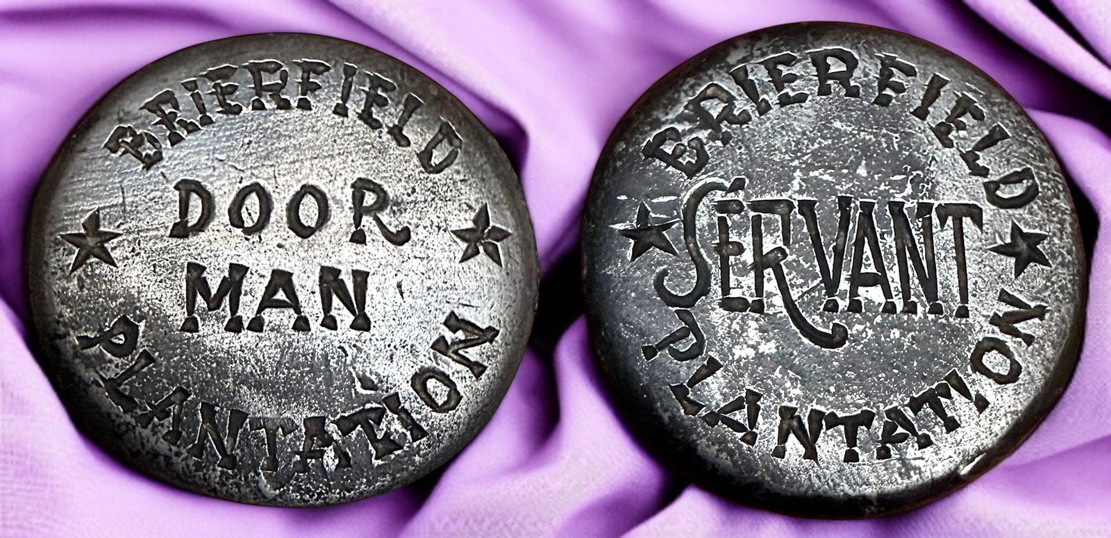 A VERY RARE PAIR OF USAGE/UNIFORM BUTTONS: 2 Medium size 19th century incredibly RARE Slave buttons. Here are two buttons that do NOT come up for sale and although they represent a part of our history that many want to forget and certainly sho