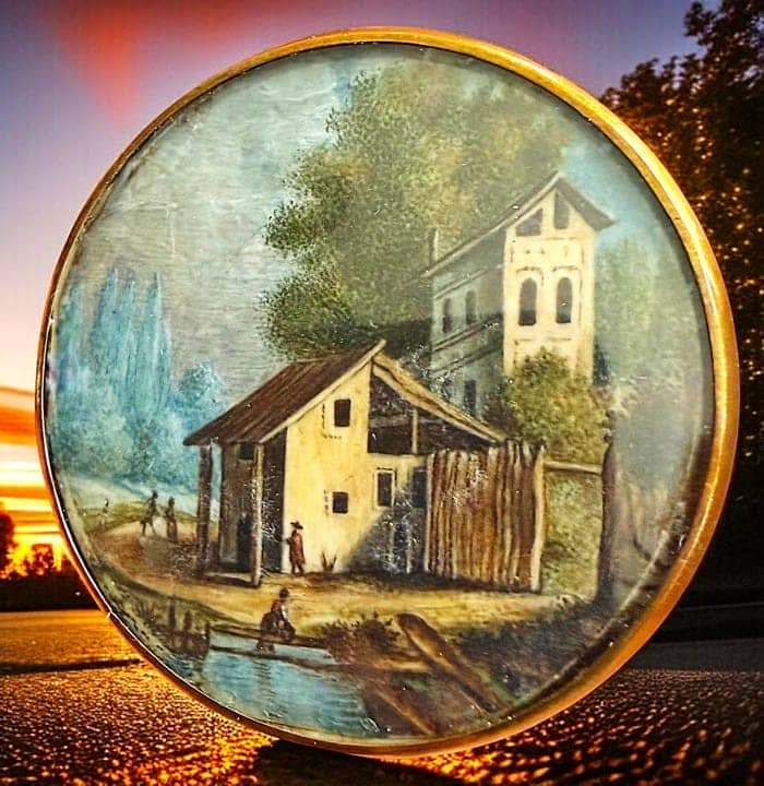 A DIVISION ONE DETAILED SCENE UNDER GLASS BUTTON: 1 Extra Large architectural scene under glass hand painted button. This is a very finely detailed and colorful example of late 19th early 20th century artistry and is set under glass in a brass