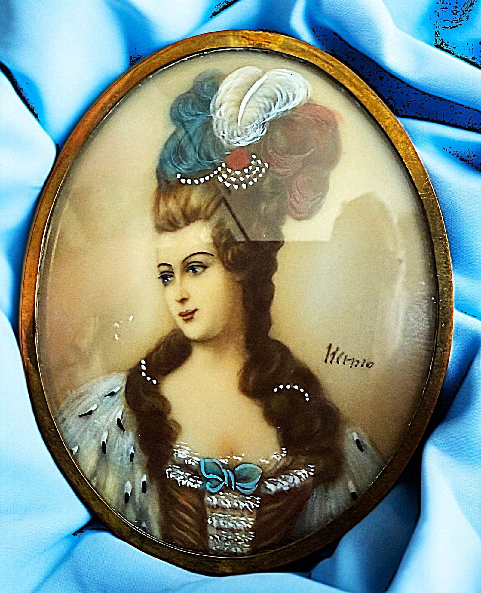 A DIVISION ONE HAND PAINTING UNDER GLASS BUTTON: 1 Ex-Large oval signed late 19th C. painting under glass of a lady. Here is a beautifully detailed and executed button of a women in a big headdress with feathers and big hair. The fine detail and col