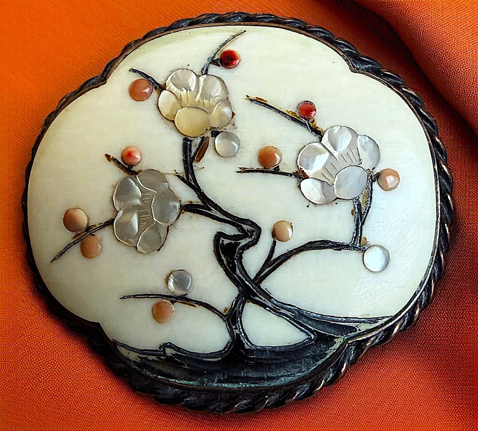 A DIVISION ONE JAPANESE SHIBAYAMA BUTTON: 1 Large 19th C. rare shaped inlay in natural material example. Here is an exquisite example of 19th century Japanese craftsmanship know as Shibayamma work. The natural material base is inlayed in this