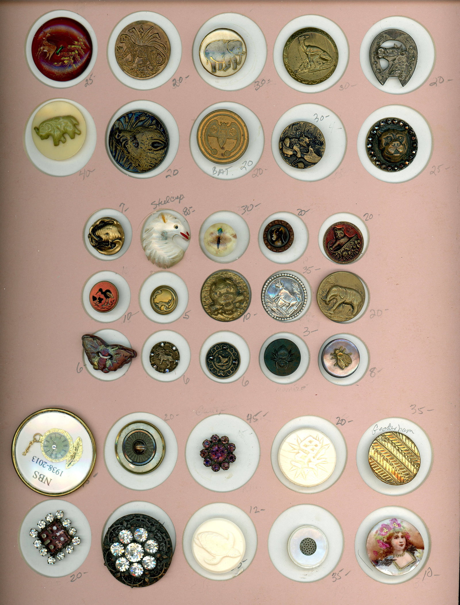 A CARD OF DIVISION 1 & 3 ASSORTED MATERIAL BUTTONS: 30 Small/Medium 19th/20th C. examples including pictorial. This card from the collectionm of Jose Roman includes a plethora of techniques and materials including a wonderful insect paperweight, a reve